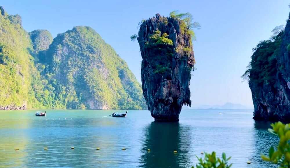 The iconic needle-shaped limestone karst rock of Koh Tapu rising from calm waters at James Bond Island in Phang Nga Bay, Thailand.