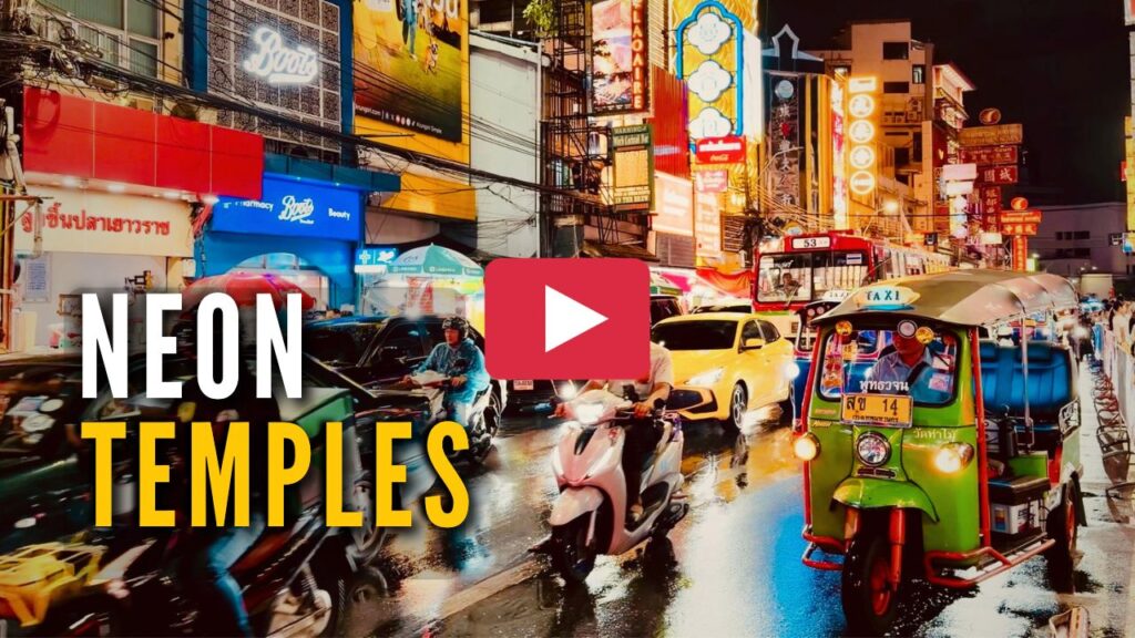 YouTube video thumbnail with a play icon overlay showing a vibrant night scene on Yaowarat Road in Bangkok with a green tuk-tuk and neon signs.