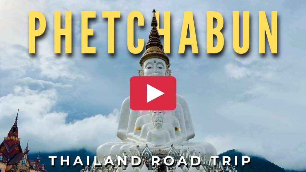 Video thumbnail image featuring the giant nested white Buddha statues of Wat Phra That Pha Sorn Kaew in Phetchabun with yellow text reading Phetchabun Thailand Road Trip and a play button icon.